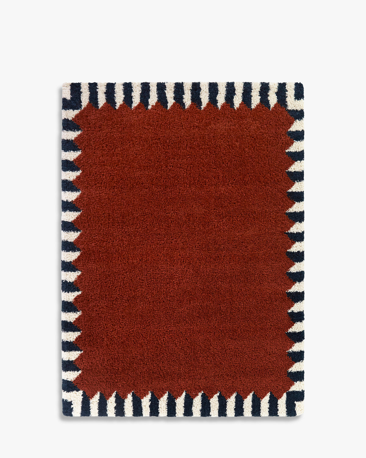 tapis de salon Ardmore petit format terracotta à bordure en dents bleu marine et écrue - vu de dessus