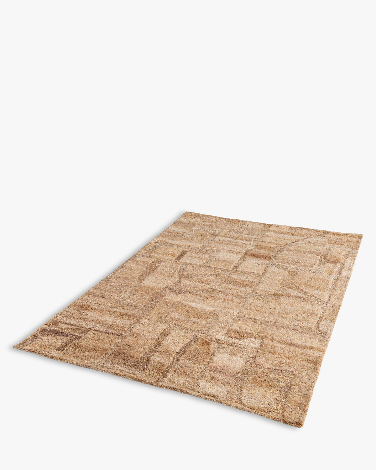 tapis de salon Shard rectangulaire à poils longs beige chiné - vue de trois quarts